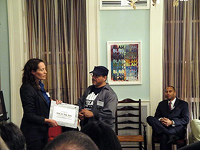 Maggie Williams presenting the award to Ramon Velasquez